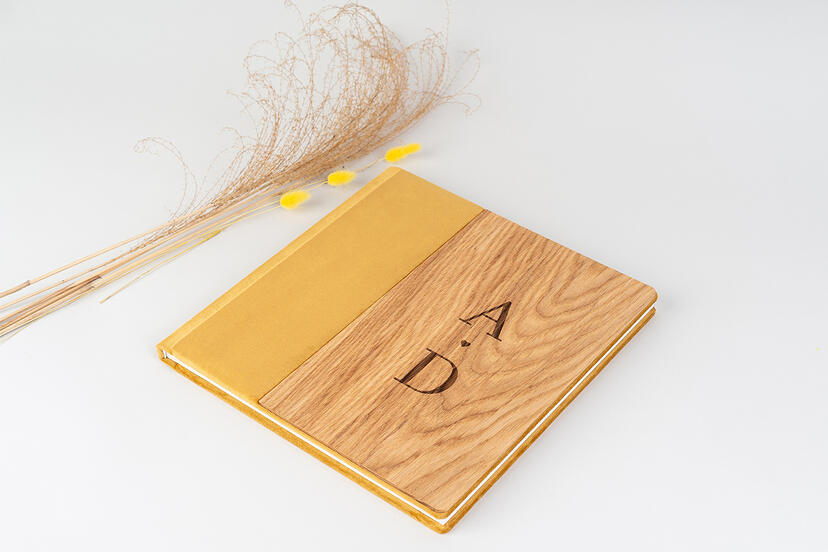 Wooden cover with mustard material cover on a Photo Album