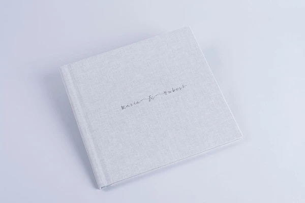 Exclusive photo book with names on the cover white nphoto printing lab for professional photographers classic look